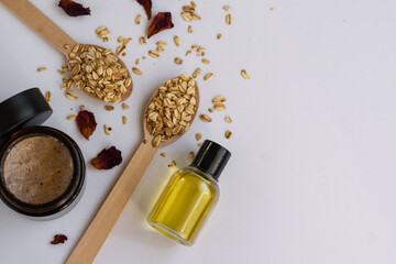 Top view of natural cosmetic products with oats, dry flowers and herbs. Wellness beauty treatment. Organic health care products