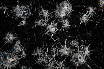 cracks on black glass background, broken abstract glass hole destruction concept