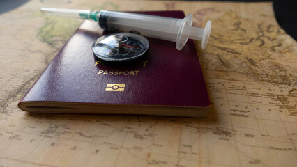 Vaccination Passports on map with compass and vaccine it self, covid-19 concept