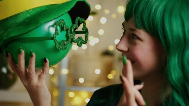 St Patrick day party concept. Girl with green hair having fun celebrating Saint Patrick's day.
