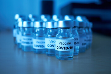 canisters with covid-19 vaccines