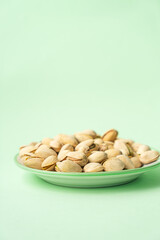 toasted pistachios in a plate. Nuts vegan protein