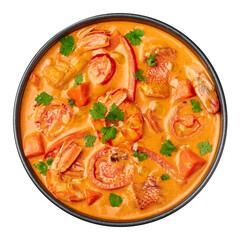 Moqueca with Fish and Shrimps in black bowl isolated on white. Brazilian sea food curry dish with...