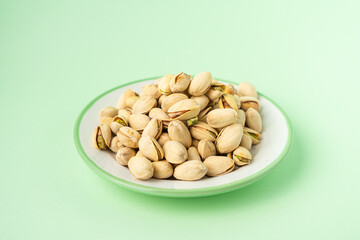 toasted pistachios in a plate. Nuts vegan protein