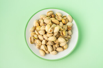 toasted pistachios in a plate. Nuts vegan protein
