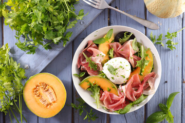 melon with prosciutto ham, mozzarella and basil