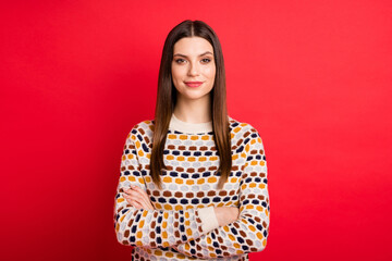 Fototapeta premium Photo portrait of smiling student folded hands wearing casual sweater smiling isolated vivid red color background