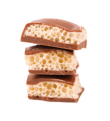 Tasty porous chocolate, isolated on white background. White aerated chocolate.