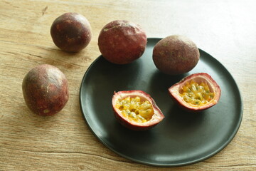 passion fruit taste sweet and sour half cut on plate