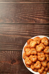 Homemade oven fresh sugar sprinkled biscuits on a rustic kitchen table. 