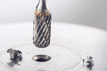 Milling сutter make sink in hole in steel billet. Locksmith work.