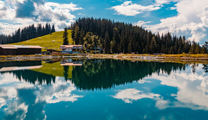 Beautiful alpine summer view with reflections in a lake at the famous Astberg summit, Going, Wilder...