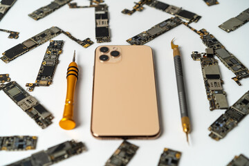 Closeup of smartphone ready to repair. A close up picture of isolated mobile phone getting ready to...