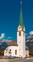 Fototapeta na wymiar Beautiful church on a sunny day at Ellmau, Wilder Kaiser, Tyrol, Austria