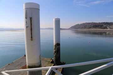 Obraz premium Columns associated with the floating pontoon and landing stage at Beaumaris Pier, Isle of Anglesey, Wales, UK.