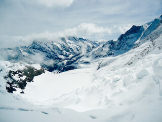 Fototapeta na wymiar Snow-capped mountains on the way to Jungfrau, Switzerland