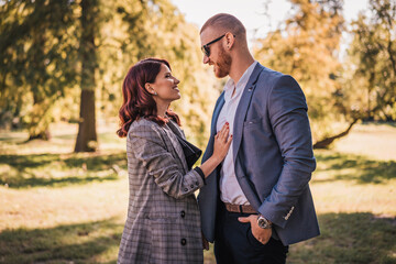 Beautiful young couple in park. Love and emotions concept.