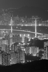 Aerial view of bridge and dowtown of Hong Kong city at night