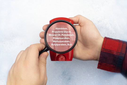 Antiperspirant floating in soapy water. Harmful composition of ingredients. Dry stick deodorant stick with Aluminum. The concept of hazardous substances in cosmetics and household chemicals