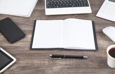 Pen and notepad on the desk. Business workplace