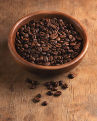 Coffee beans on wood background