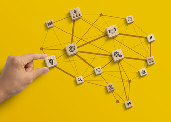 Business strategy, business management or business success concept. Hand is arranging wooden blocks...