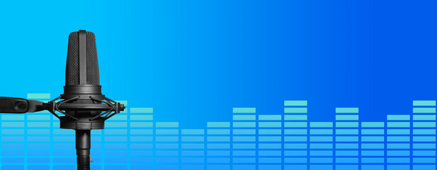 Studio recording microphone and vu meter on blue background with copy space for podcast, broadcast...