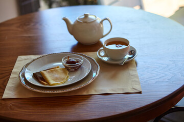 Pancakes With Honey And Tea. Tasting traditional Russian cuisine
