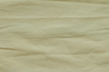 Fototapeta na wymiar Texture of yellow fabric for clothing.
