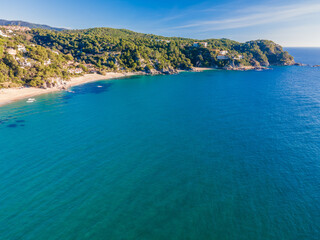 Fototapeta na wymiar aerial images of lloret de mar virgin beach turquoise blue water without people transparent europe mediterranean sea