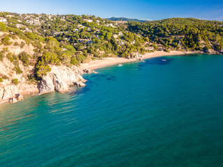 Fototapeta na wymiar aerial images of lloret de mar virgin beach turquoise blue water without people transparent europe mediterranean sea