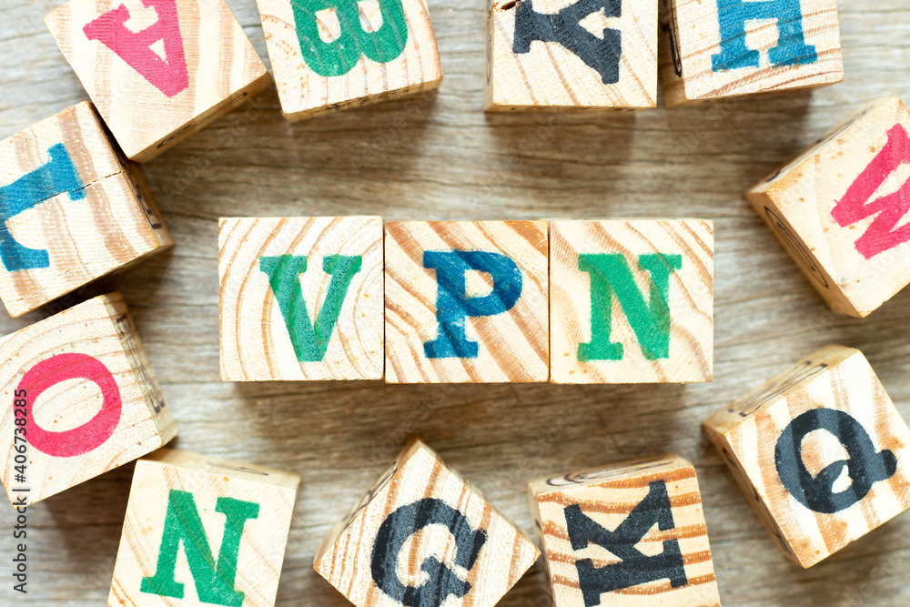 Poster Alphabet letter block in word  VPN (abbreviation of virtual private network) with another on wood background