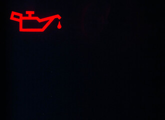 Red oil pressure indicator on the car dashboard. Engine lubrication system malfunction concept,...