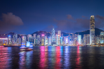 Skyline Hong Kong city at sunset view from harbor in Hong Kong.