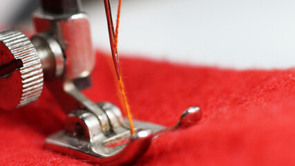sewing machine and red clot, macro object