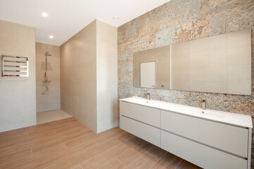 Modern bathroom with luxury tiles. Large shower . Custom furniture.
