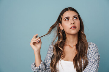 Fototapeta premium Thinking beautiful girl posing and looking upward