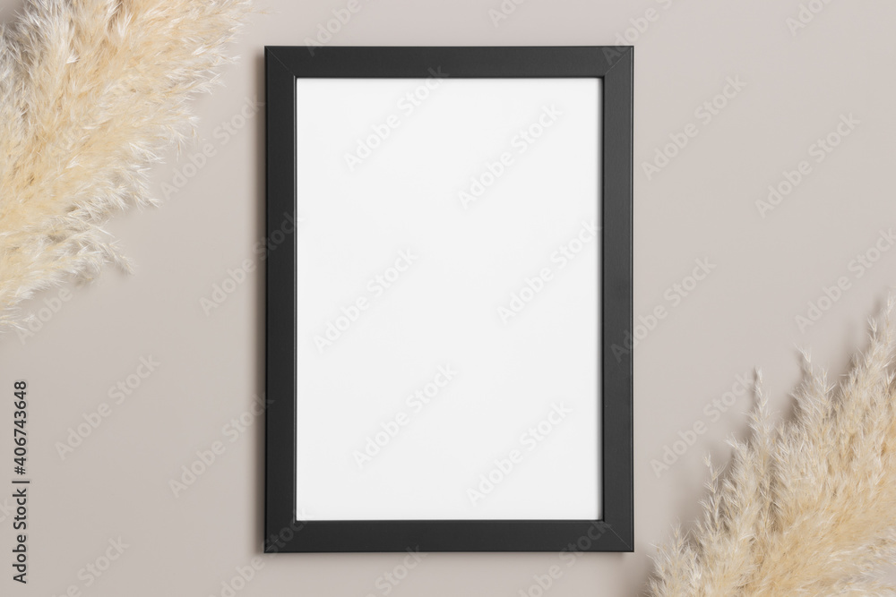 Canvas Prints Top view of a black frame mockup with pampas decoration.