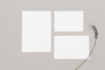 Wedding invitation stationery mockup with a lavender decoration. Dimensions: 5x7