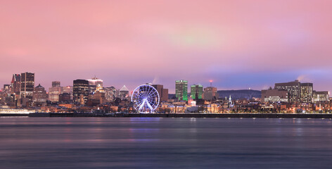 Fototapeta premium Montreal skyline and St Lawrence River at dusk in winter, Quebec, Canada 