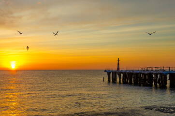 Fototapeta premium Dawn over the sea.The sun is above the water in the early morning.