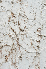 Texture of a gray wall with peeling plaster. Textured wall for background.