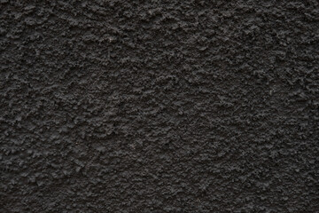 Fototapeta premium The texture of the black textured wall. Dark wall for background.