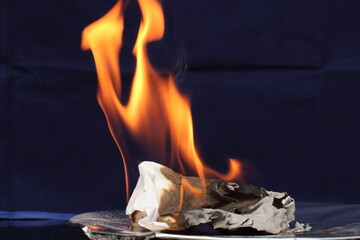burning paper on fire