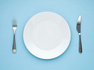 empty white plate blue  background