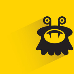 funny monster with shadow on yellow background