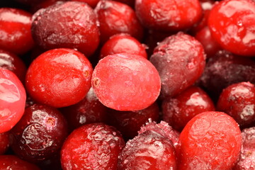 Several berries of natural freshly frozen cranberries, close-up.