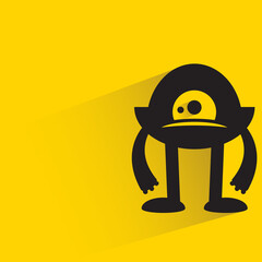 funny monster with shadow on yellow background