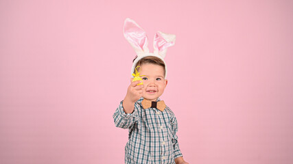 Child and easter, on pink background