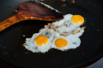 fried eggs in a frying pan